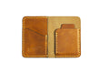 brown full grain leather minimalist bifold wallet hand made for men and women that holds cash and cards better than a Ridge wallet.