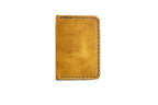 Tan full grain leather minimalist bifold handmade wallet for men and women that holds cash and cards better than a Ridge wallet.